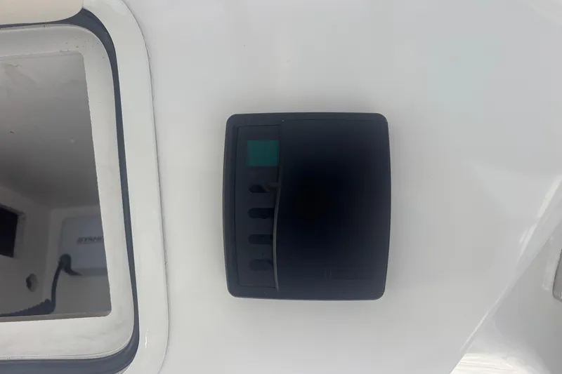 Slide: The Image of Control panel on 2006 Sea Ray 52 Sedan Bridge yacht interior. - 25