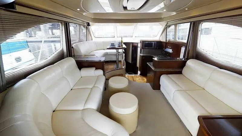 Slide: The Image of Luxurious interior of 2006 Sea Ray 52 Sedan Bridge yacht with leather seating and scenic view. - 32