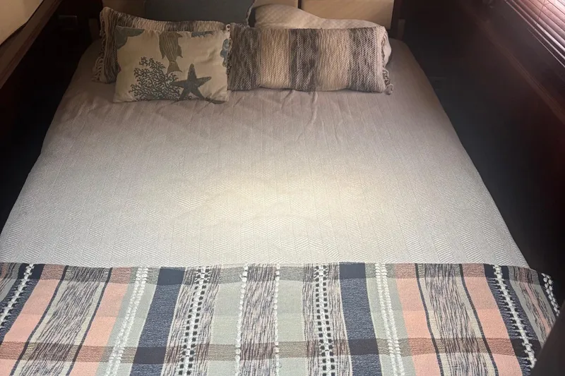 Slide: The Image of Cozy bedroom interior of 2006 Sea Ray 52 Sedan Bridge yacht with decorative pillows. - 41