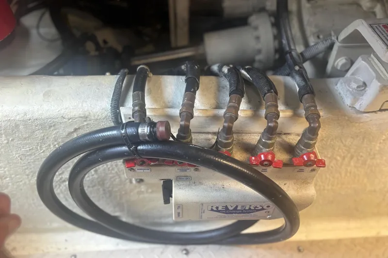 Slide: The Image of Engine room of 2006 Sea Ray 52 Sedan Bridge with Cummins Marine engine. - 54