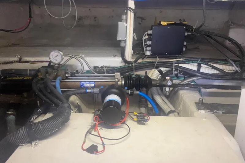 Slide: The Image of Engine room of a 2006 Sea Ray 52 Sedan Bridge with various mechanical components. - 60