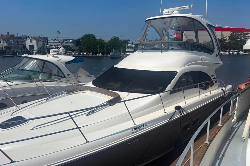 Slide: The Image of 2006 Sea Ray 52 Sedan Bridge yacht docked at a marina. - 8