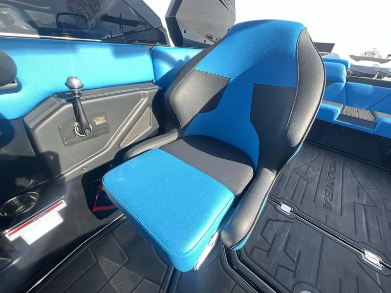 Slide: The Image of 2025 Moomba Mojo boat interior with blue and black seating. - 13