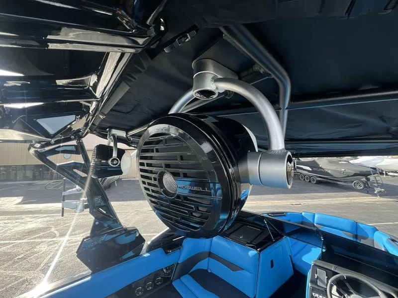 Slide: The Image of 2025 Moomba Mojo boat interior with Roswell speaker and blue seating. - 21