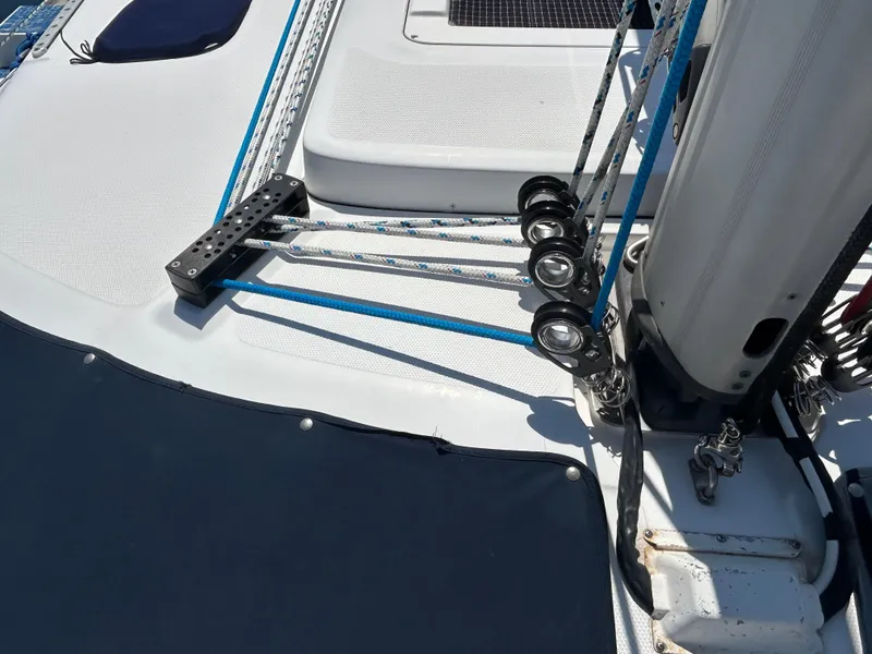 Slide: The Image of Deck of 1998 Hunter Passage 450 sailboat with rigging and pulleys. - 11
