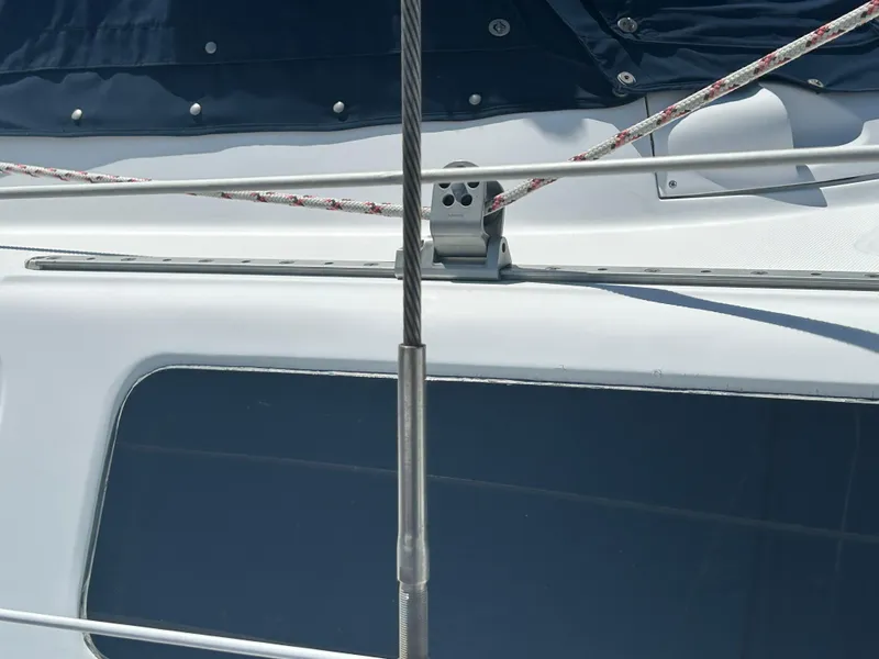 Slide: The Image of Close-up of 1998 Hunter Passage 450 yacht deck with rigging and window. - 18
