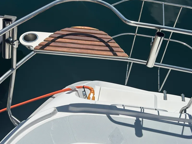 Slide: The Image of Hunter Passage 450 sailboat deck detail with stainless steel railings and wooden step, 1998 model. - 3