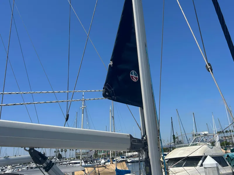Slide: The Image of Sailboat mast and rigging of 1998 Hunter Passage 450 in marina under clear blue sky. - 6