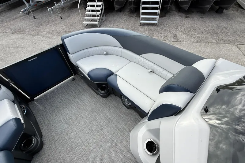 Slide: The Image of 2025 Avalon LSZ Quad Lounger interior with gray and blue seating, showcasing luxury design. - 40