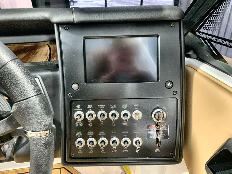 Slide: The Image of 2025 Moomba Mondo dashboard with touchscreen and control switches. - 15