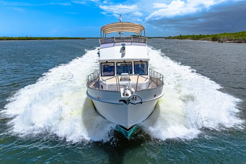 Slide: The Image of 2008 Grand Banks 47 Classic yacht cruising on open water. - 15