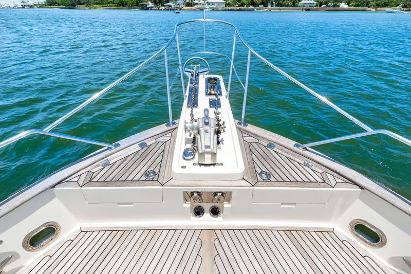 Slide: The Image of Bow view of 2008 Grand Banks 47 Classic yacht on calm water. - 28