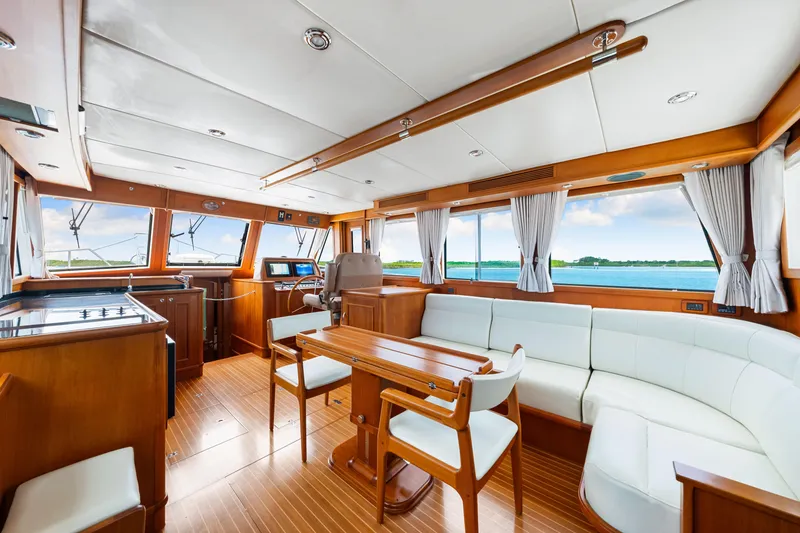 Slide: The Image of Interior of 2008 Grand Banks 47 Classic yacht with elegant wood finish and panoramic windows. - 39
