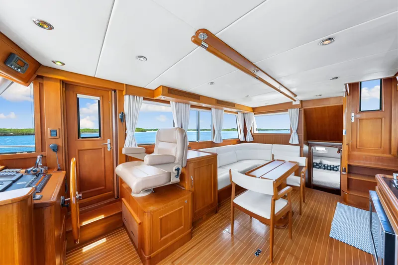 Slide: The Image of Luxurious 2008 Grand Banks 47 Classic yacht interior with elegant wood finish and spacious seating. - 48