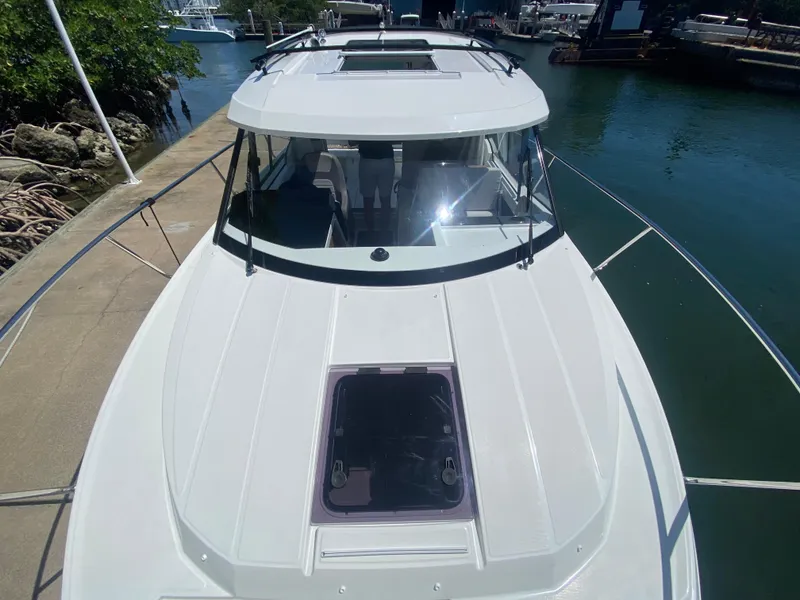 Slide: The Image of 2023 Jeanneau NC Weekender 795 Series 2 docked at marina, top view. - 11