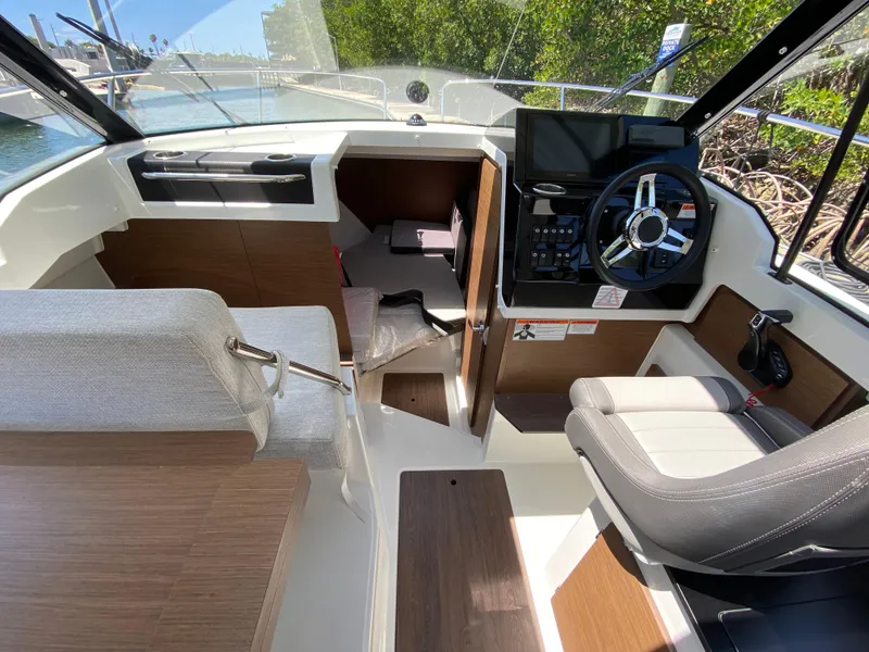 Slide: The Image of 2023 Jeanneau NC Weekender 795 Series 2 interior with modern helm and seating. - 15