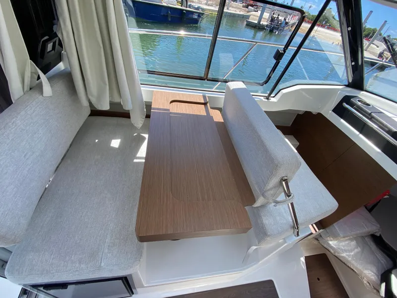 Slide: The Image of Interior of 2023 Jeanneau NC Weekender 795 Series 2 with seating and table. - 19