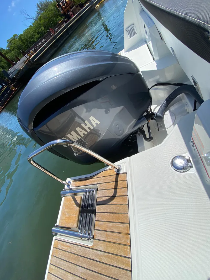 Slide: The Image of 2023 Jeanneau NC Weekender 795 Series 2 with Yamaha outboard motor and swim ladder. - 20