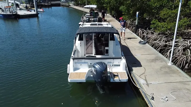 Slide: The Image of 2023 Jeanneau NC Weekender 795 Series 2 docked at marina, rear view. - 21