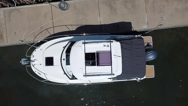 Slide: The Image of Overhead view of 2023 Jeanneau NC Weekender 795 Series 2 docked at marina. - 22