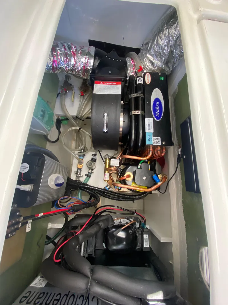 Slide: The Image of Engine compartment of 2023 Jeanneau NC Weekender 795 Series 2 boat. - 24