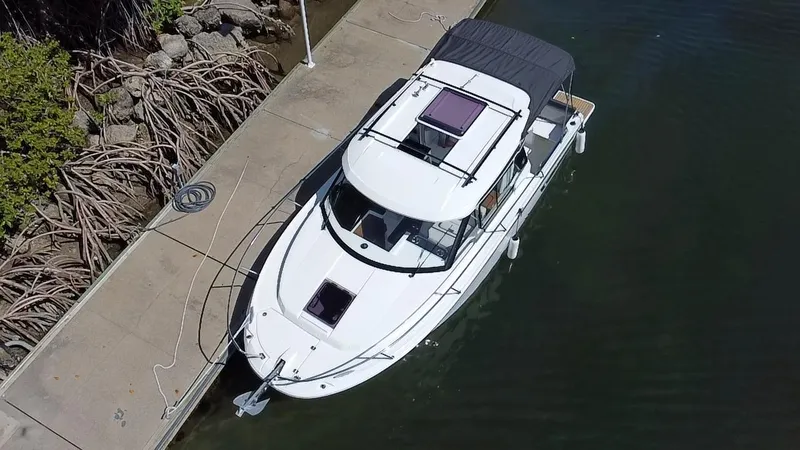 Slide: The Image of 2023 Jeanneau NC Weekender 795 Series 2 docked at marina, aerial view. - 8