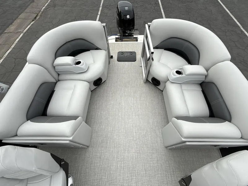 Slide: The Image of 2025 Landau Island Breeze 19 C pontoon boat interior with plush seating and cup holders. - 10