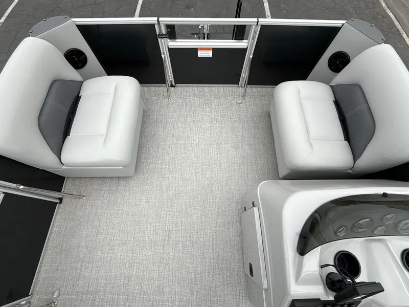 Slide: The Image of 2025 Landau Island Breeze 19 C pontoon boat interior with gray seating and modern dashboard. - 11
