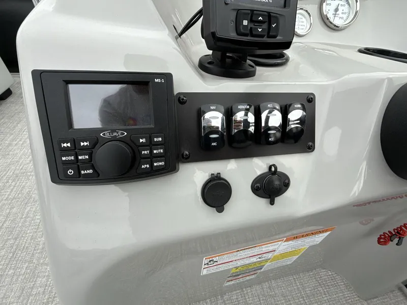 Slide: The Image of Control panel of 2025 Landau Island Breeze 19 C boat with switches and display. - 15
