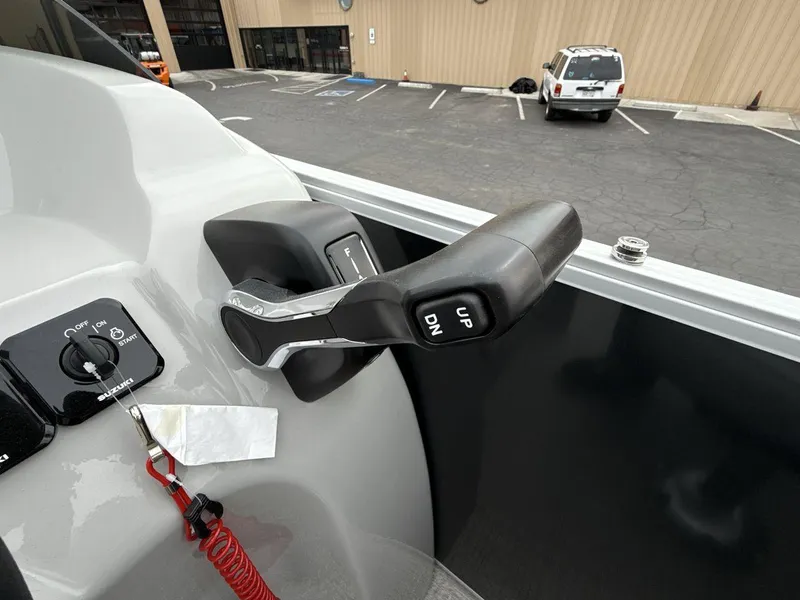 Slide: The Image of 2025 Landau Island Breeze 19 C boat controls with throttle and ignition switch. - 16