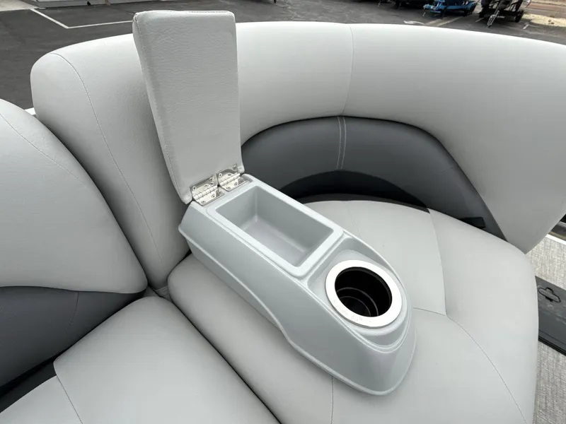 Slide: The Image of 2025 Landau Island Breeze 19 C boat seat with cup holder and storage compartment. - 19
