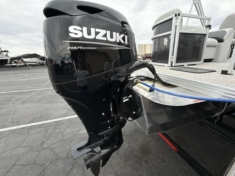 Slide: The Image of 2025 Landau Island Breeze 19 C with Suzuki four-stroke outboard motor. - 20
