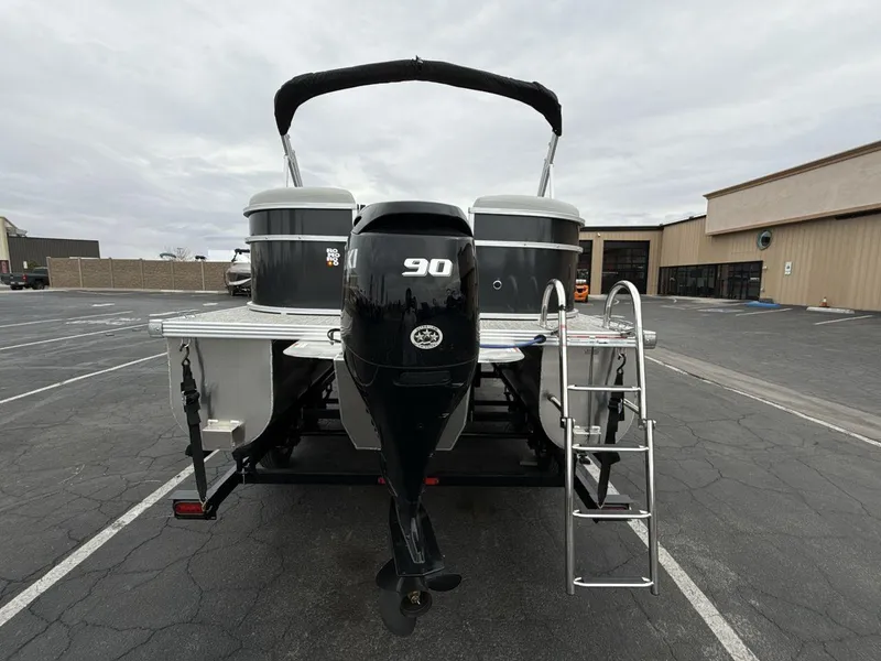 Slide: The Image of 2025 Landau Island Breeze 19 C pontoon boat with 90 HP engine and ladder. - 4