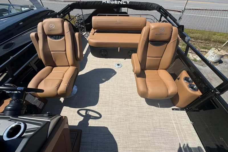 Slide: The Image of 2025 Regency 250 LE3 Sport boat interior with tan leather seating and modern design. - 7