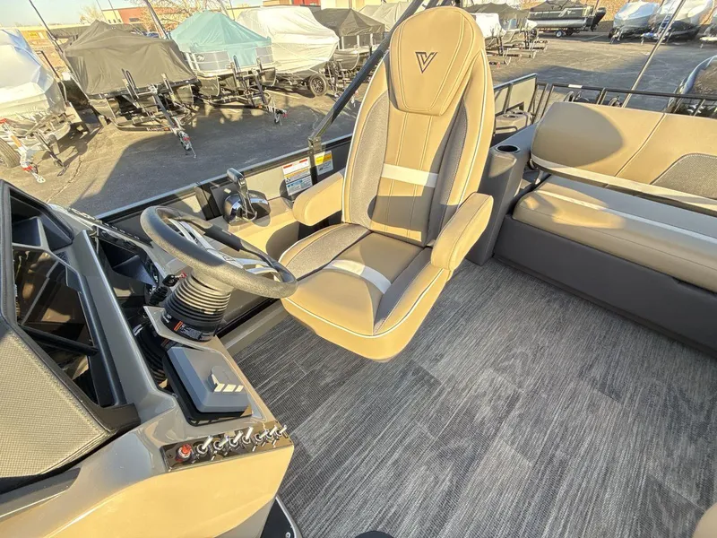 Slide: The Image of Interior of 2025 Viaggio x24s boat with steering wheel and captain's chair. - 13