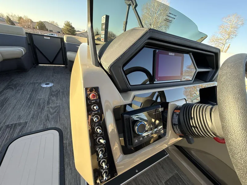 Slide: The Image of Interior view of 2025 Viaggio x24s boat dashboard with modern controls and steering wheel. - 15