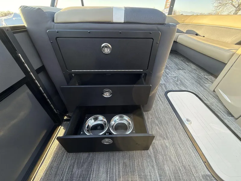 Slide: The Image of 2025 Viaggio x24s interior with open storage drawers and built-in cup holders. - 18