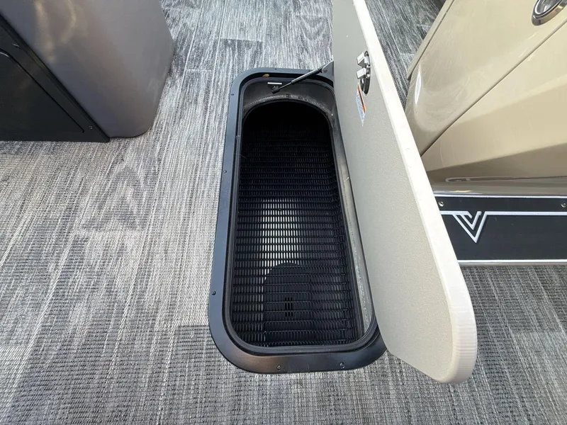 Slide: The Image of Open storage compartment in 2025 Viaggio x24s boat, featuring carpeted flooring. - 20
