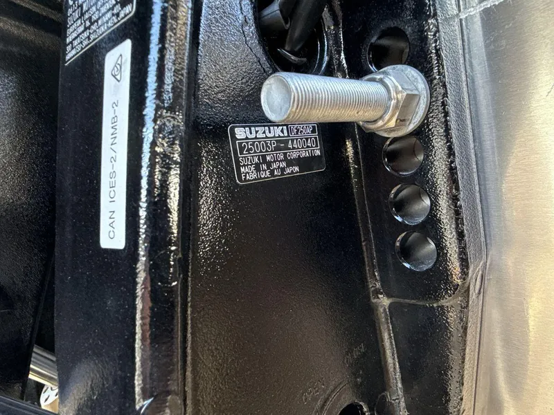 Slide: The Image of Close-up of a Viaggio x24s 2025 engine part with Suzuki label and bolt. - 22