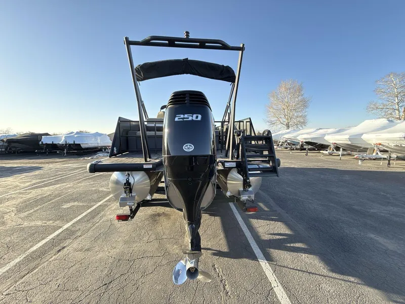 Slide: The Image of 2025 Viaggio x24s pontoon boat with 250 HP engine, parked outdoors. - 4