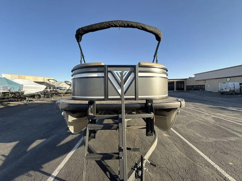 Slide: The Image of 2025 Viaggio x24s pontoon boat on trailer in parking lot. - 8