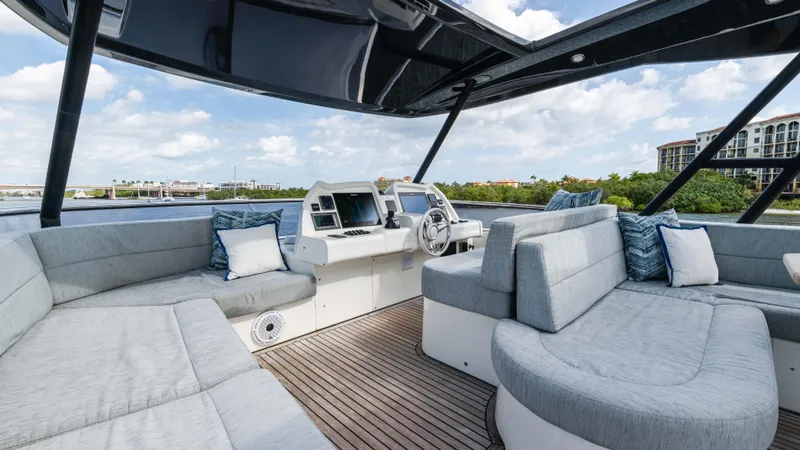 Slide: The Image of Luxurious 2016 Monte Carlo Yachts MCY 65 interior with plush seating and modern helm. - 12