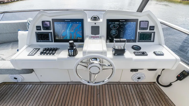 Slide: The Image of Helm of 2016 Monte Carlo Yachts MCY 65 with advanced navigation displays and controls. - 14