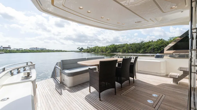 Slide: The Image of Luxurious 2016 Monte Carlo Yachts MCY 65 deck with elegant seating and scenic water view. - 21