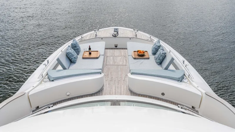 Slide: The Image of Luxurious 2016 Monte Carlo Yachts MCY 65 deck with elegant seating and refreshments. - 24