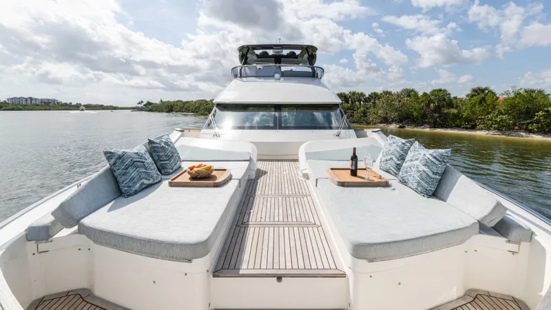 Slide: The Image of Luxurious 2016 Monte Carlo Yachts MCY 65 with elegant deck seating and scenic water view. - 25
