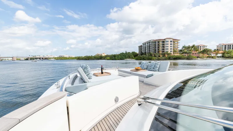 Slide: The Image of Luxurious Monte Carlo Yachts MCY 65, 2016 model, cruising near waterfront buildings. - 27