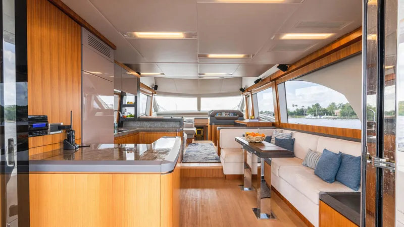 Slide: The Image of Luxurious interior of 2016 Monte Carlo Yachts MCY 65 with modern furnishings and panoramic windows. - 28