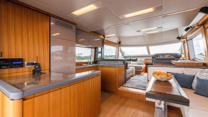 Slide: The Image of Luxurious interior of 2016 Monte Carlo Yachts MCY 65 with modern wood finishes and seating area. - 29