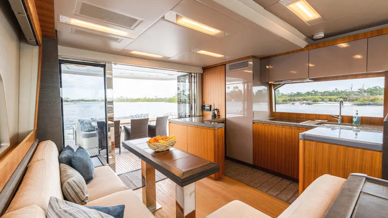 Slide: The Image of Luxurious interior of 2016 Monte Carlo Yachts MCY 65 with modern kitchen and seating area. - 30